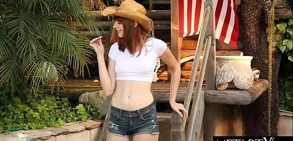  All-American beauty in a stetson hat strokes her perfect pussy